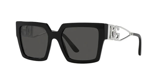 Dolce & Gabbana 0DG4446B oversized black sunglasses with silver detailing and dark lenses. Stylish and chic eyewear.