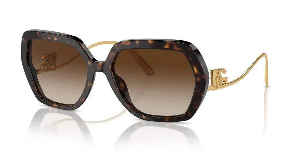 Dolce & Gabbana 0DG4468B stylish oversized sunglasses with tortoiseshell frame and gold accents.