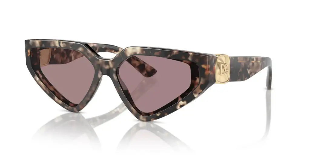 Dolce & Gabbana 0DG4469 sunglasses in tortoiseshell with pink lenses and logo detail, stylish cat-eye design.