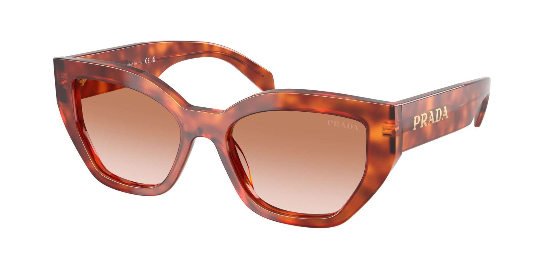 PRADA 0PR A09S sunglasses in amber tortoise shell with gradient lenses, stylish oversized cat-eye design, brand detailing.