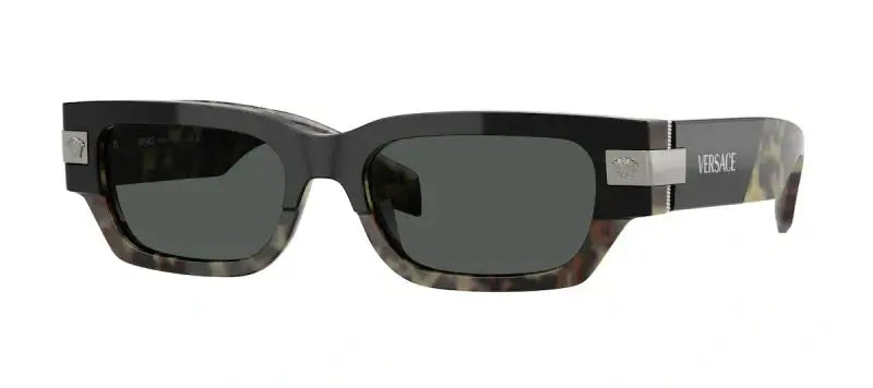 Versace 0VE4465 sunglasses featuring a stylish black and green design, perfect for chic summer outings.