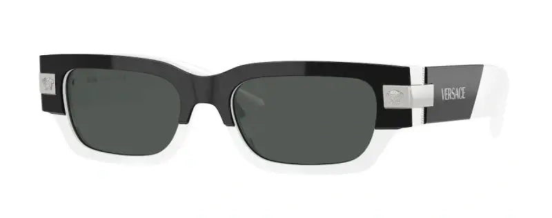 Versace 0VE4465 oversized sunglasses with black and white frame, stylish design, and tinted lenses.